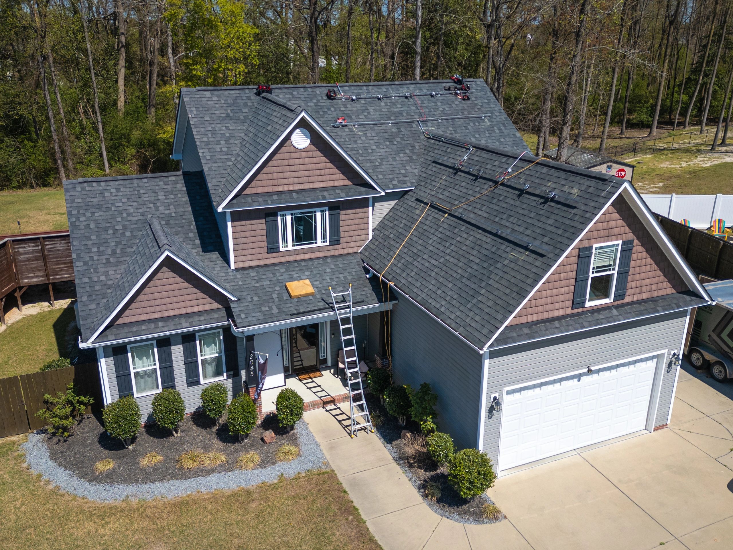 Aerial view of a finished residential roofline and exterior